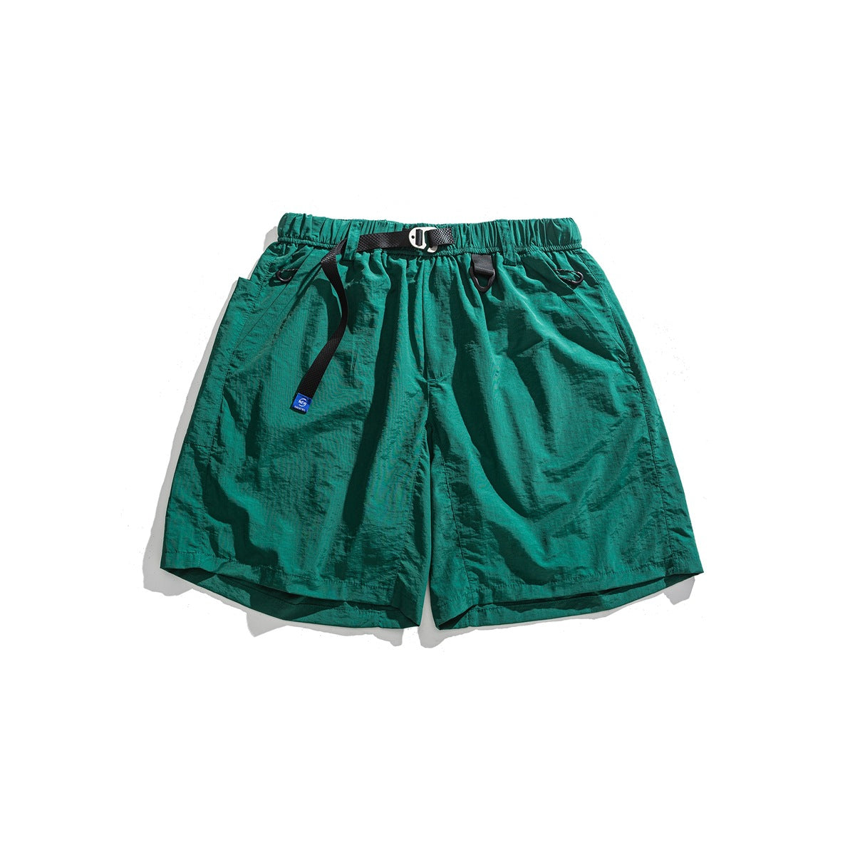 Green crinkled shorts with elastic waist, black webbing belt and metal buckle, flat lay front view
