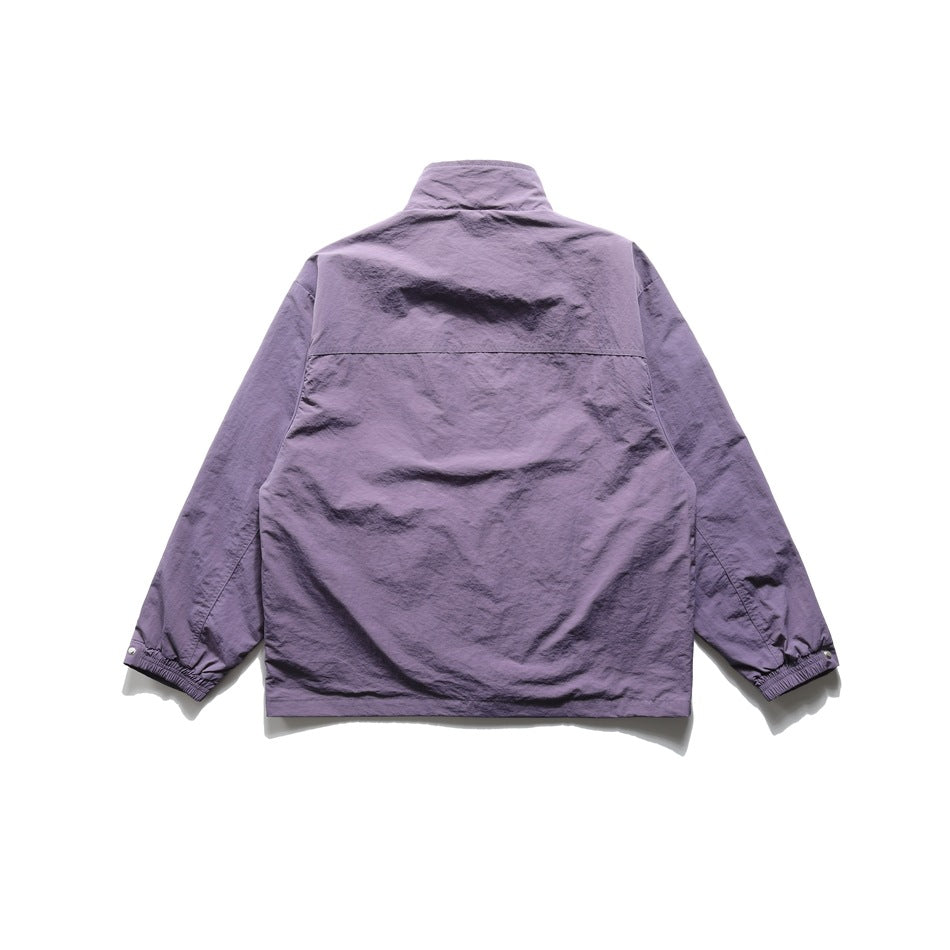 Back view of a purple long-sleeved jacket with a high collar, horizontal back seam, and gathered cuffs.