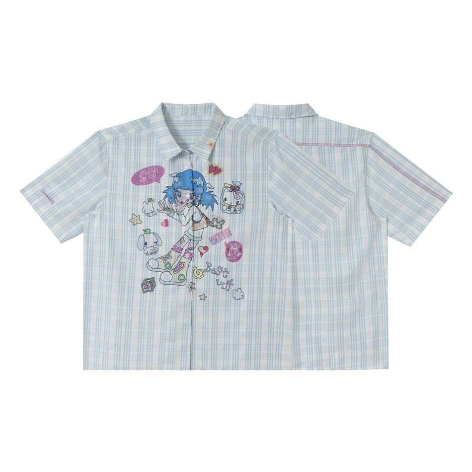 Short-sleeve pale blue plaid button-up shirt shown from the front and back; the front has colorful cartoon graphics.