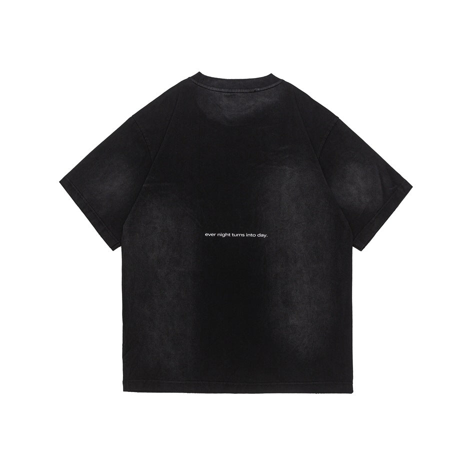 Back view of a black short-sleeve T-shirt with small white text across the center.