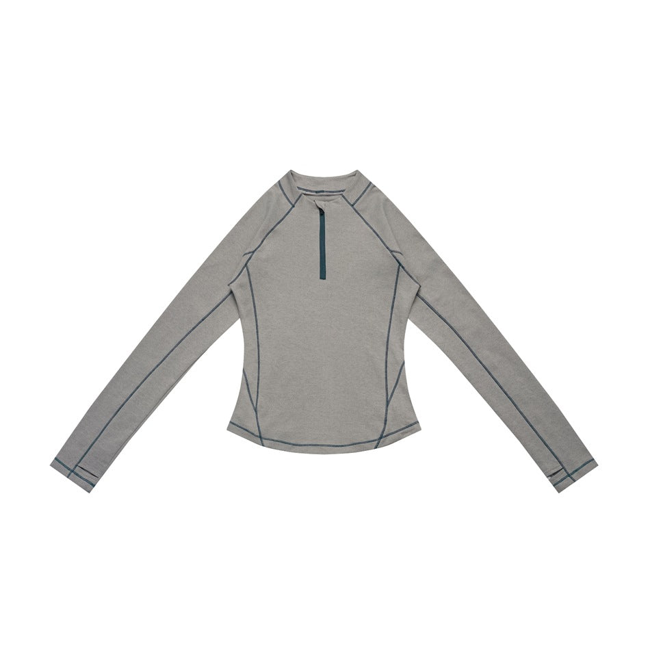 Dark gray long-sleeve half-zip top with teal contrast stitching and zipper, laid flat, front view