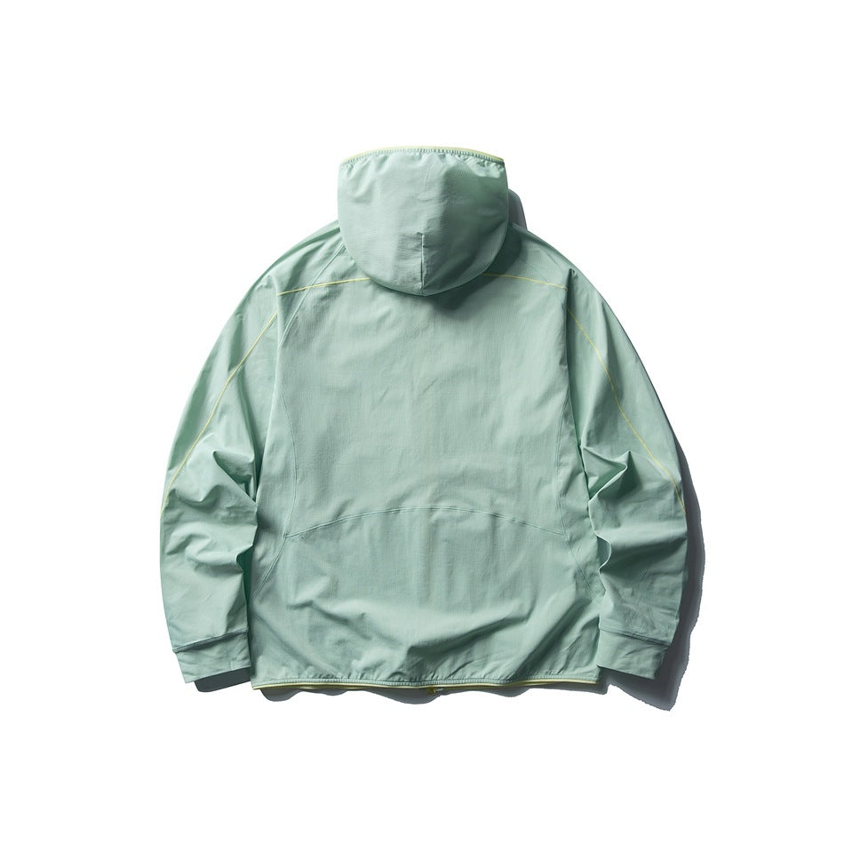 Back view of a pale mint green hooded jacket with light contrast piping and long sleeves, laid flat on white.