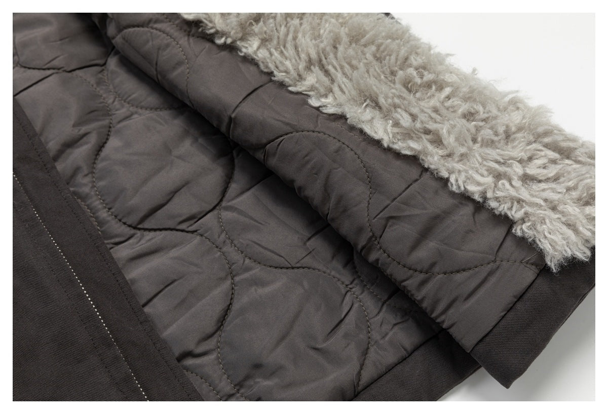Close-up of the garment's quilted inner lining and thick light gray fuzzy trim.