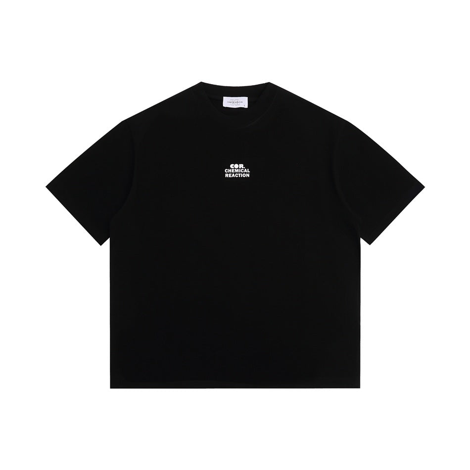 Black short-sleeve crew-neck t-shirt flat lay with a small white chest print and white neck label