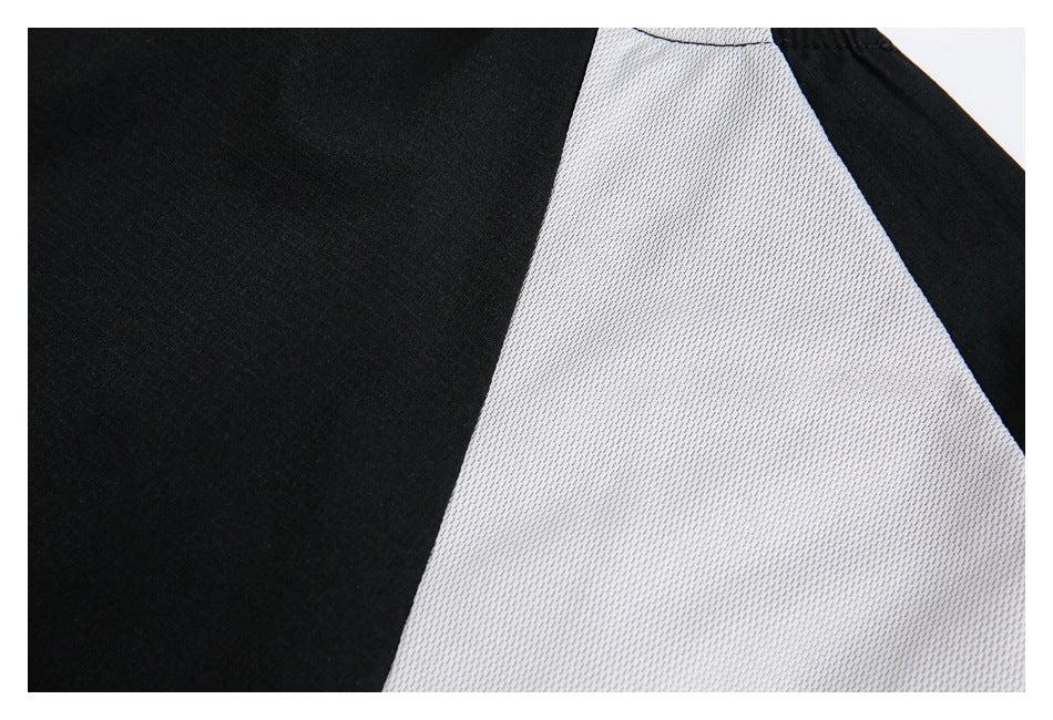 Close-up of a black panel beside a light gray textured panel.