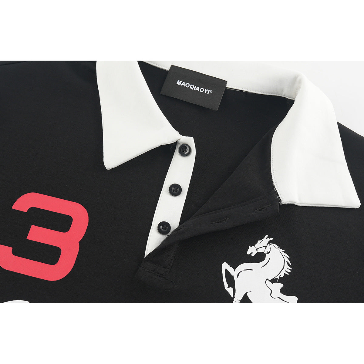 Close-up of the black polo's white collar, button placket, chest horse graphic and sewn brand label.