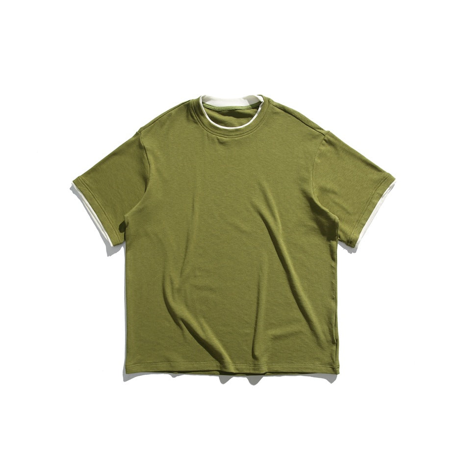 Olive green short-sleeve crew-neck tee flat lay with cream layered trim at neckline and sleeves