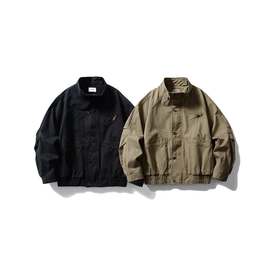 Two stand-collar jackets shown from the front, one black and one olive-khaki, with button fronts and gathered hems.