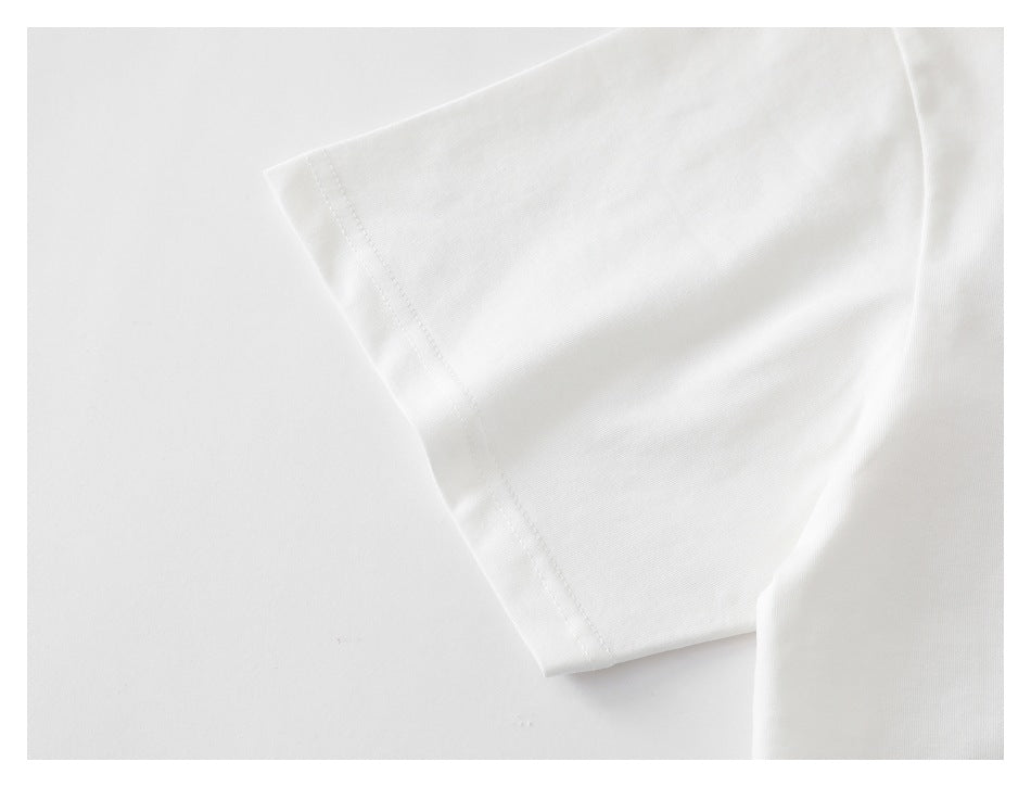Close-up of a white short sleeve and its stitched hem.