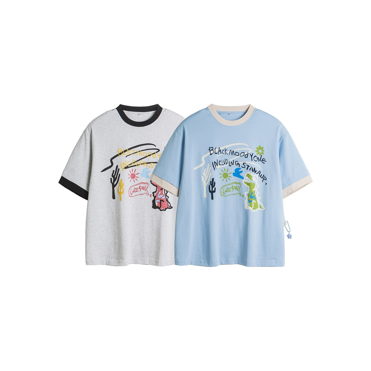 Two short-sleeve graphic T-shirts shown from the front: heather gray with black trim and light blue with cream trim.