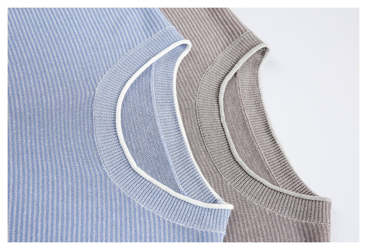 Close-up of blue and taupe striped knit tops showing ribbed crew necks with white piping.