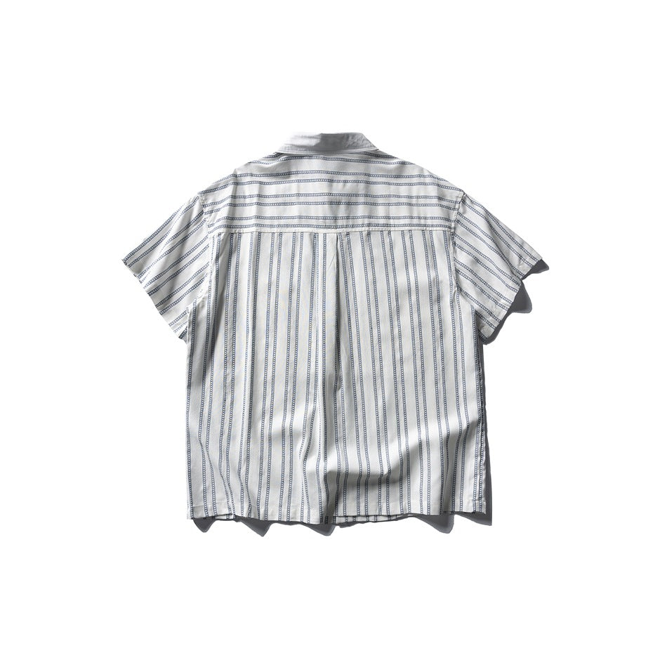 Back view of white short-sleeve shirt with blue stripes, horizontal-stripe yoke and vertical-stripe lower back