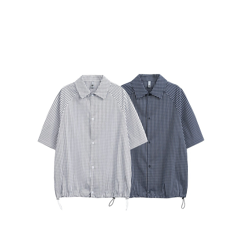 Two short-sleeve checked button-up shirts shown side by side in gray and navy colorways.