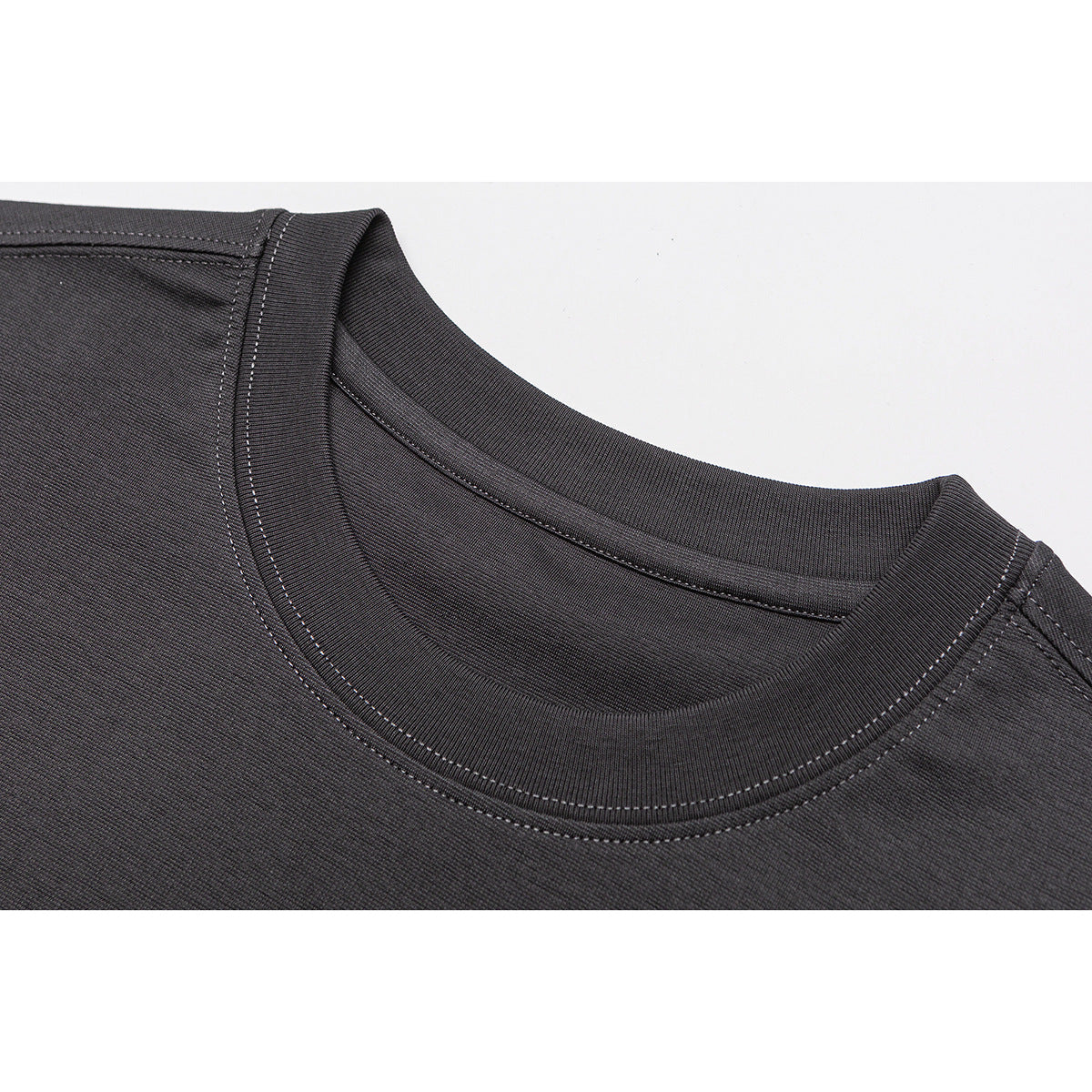 Close-up of a charcoal T-shirt's ribbed crew neck and double-stitched neckline.