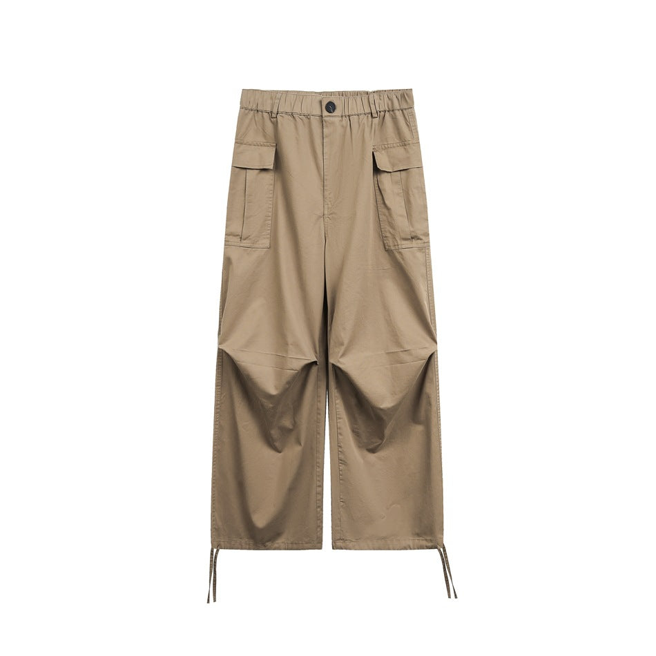 Khaki wide-leg cargo pants flat lay, front view with elastic waist, flap pockets, knee pleats and hem drawcords