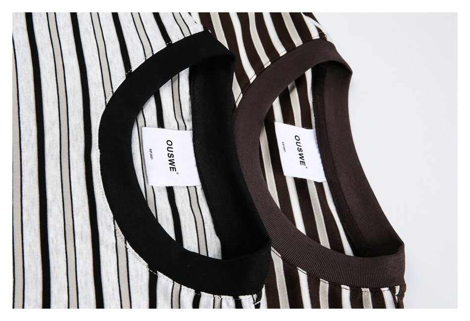 Close-up of striped T-shirt necklines, showing black trim on the white shirt and brown trim on the dark shirt.