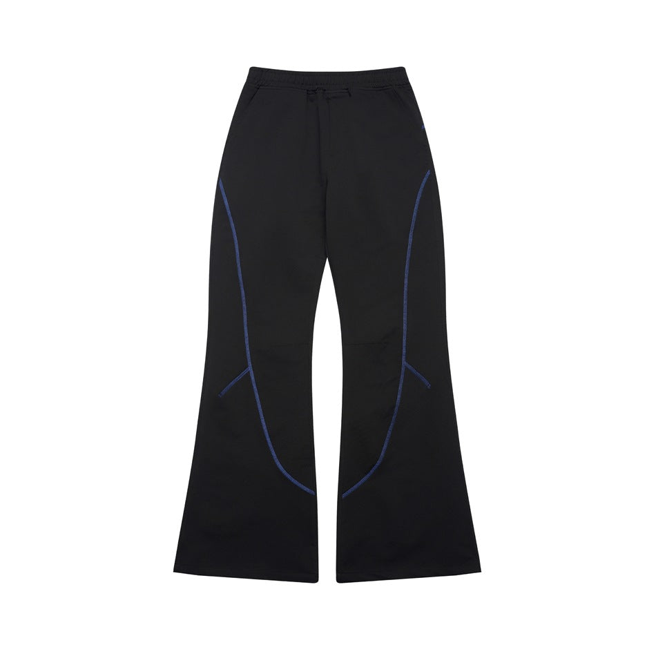 Black flared pants with elastic waistband and blue curved contrast topstitching, flat front view