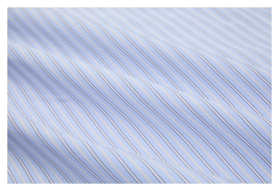 Close-up of light blue shirt fabric with narrow white and tan stripes.