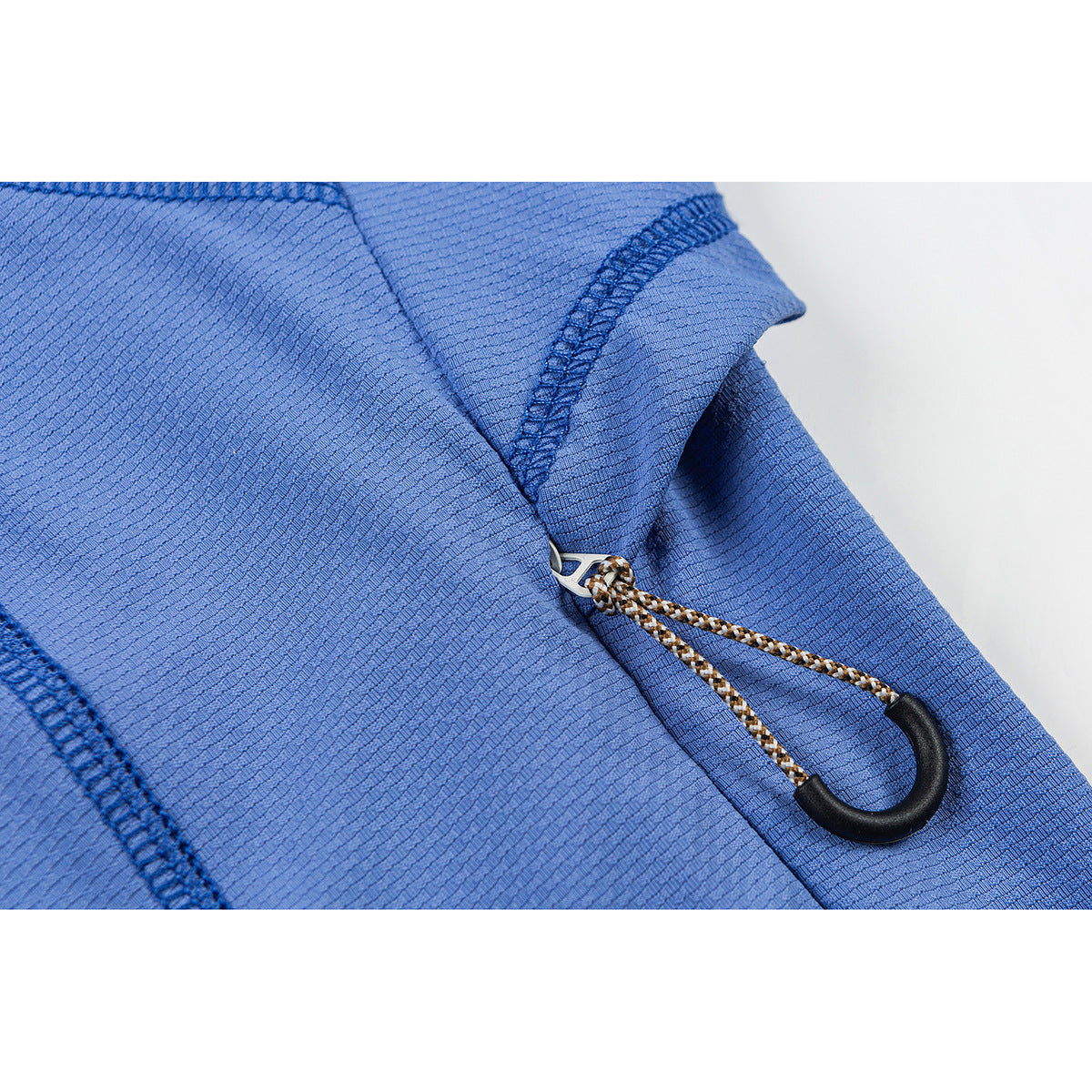Close-up of a braided drawcord with a black loop toggle on the blue jacket.