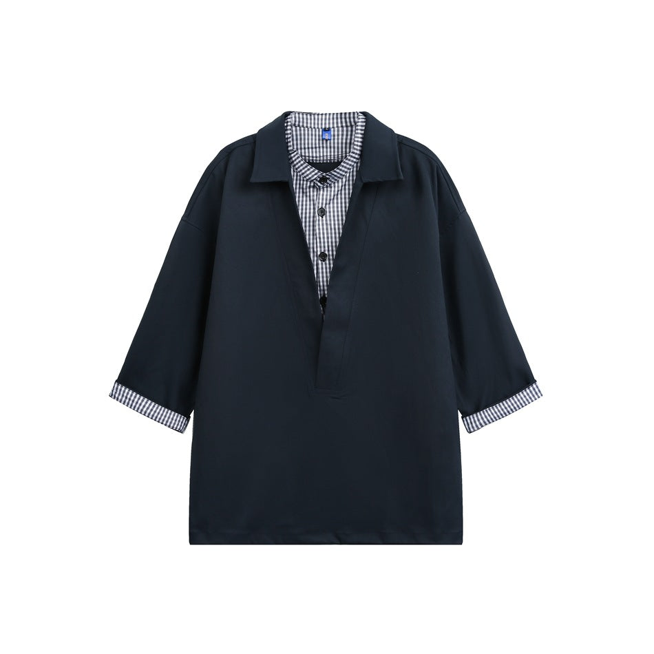 Navy faux two-piece shirt with collared V-neck outer layer, gingham shirt insert and gingham rolled cuffs, flat lay