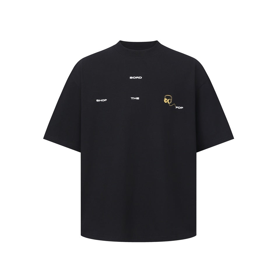 Black short-sleeve crew-neck T-shirt with small white chest text and a yellow headphone graphic, flat front view
