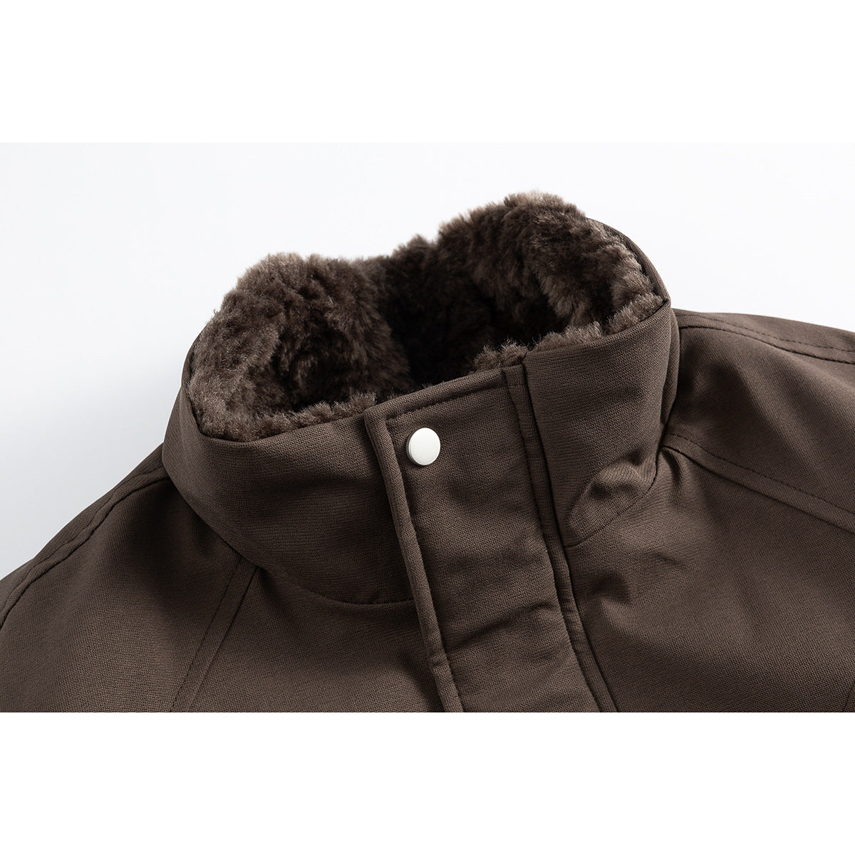 Close-up of a brown jacket's tall collar, showing plush dark lining and a snap-button front placket.