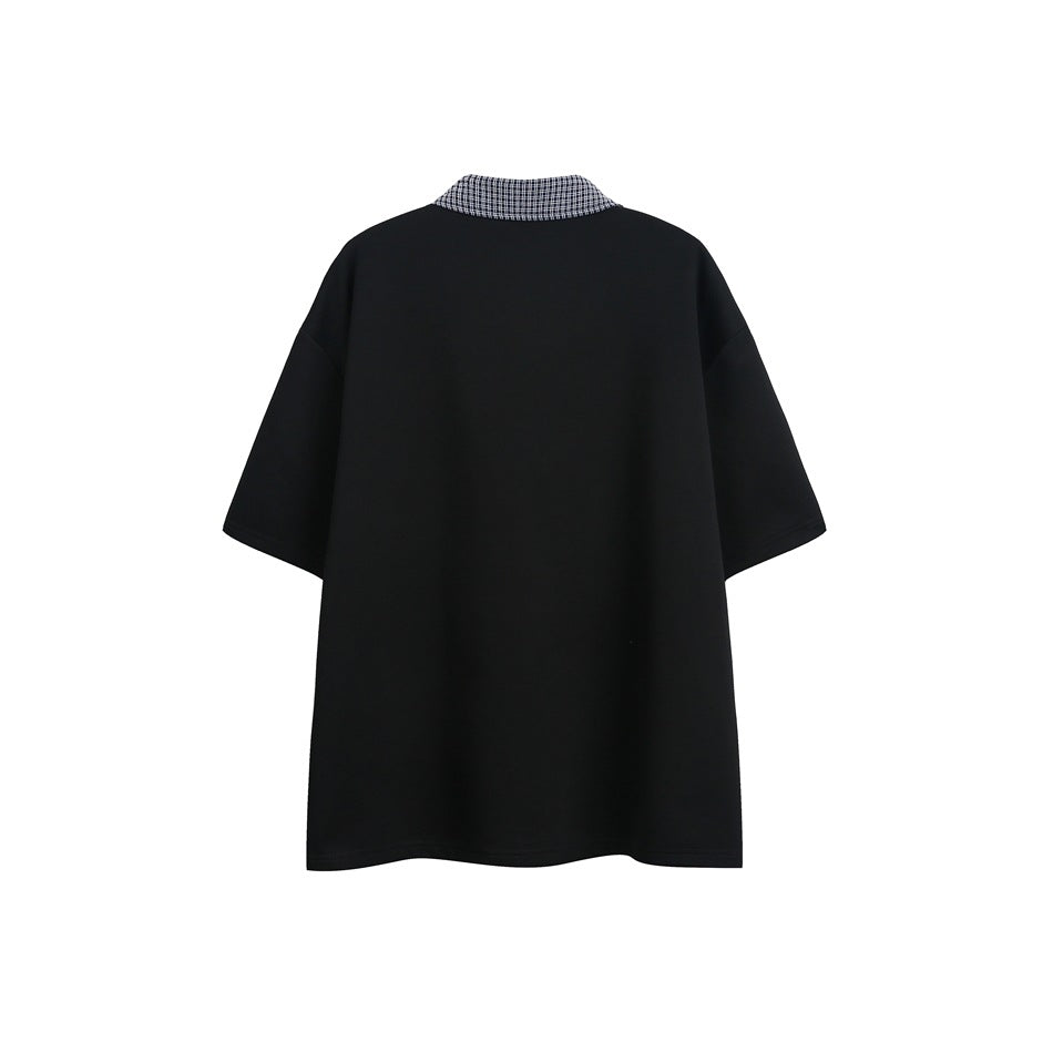 Back view of a black short-sleeve shirt with a dark checked collar, laid flat against a white background.