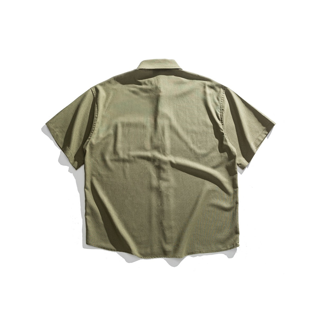 Back view of an olive short-sleeve button-up shirt displayed flat against a white background.