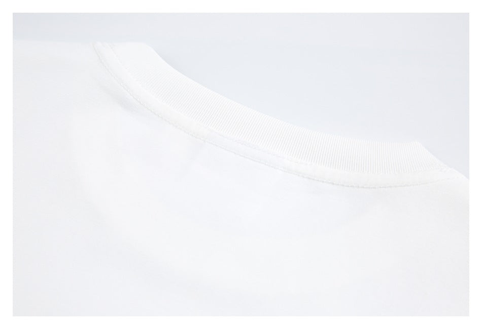 Close-up of the ribbed back neckline and shoulder area of a white T-shirt.