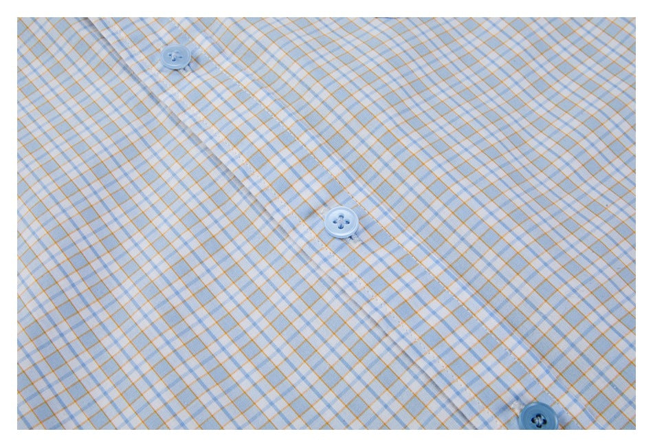Close-up of the light blue and orange checked shirt's button placket and blue buttons.