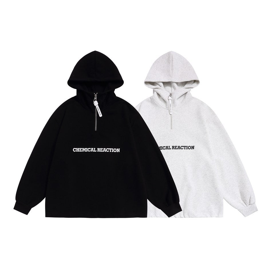 Black and light gray hoodies shown from the front, each with a quarter zipper and “CHEMICAL REACTION” lettering.