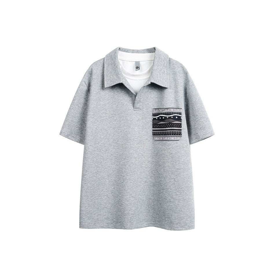 Heather gray short-sleeve polo-style top with white layered neckline and black patterned chest pocket, flat front view