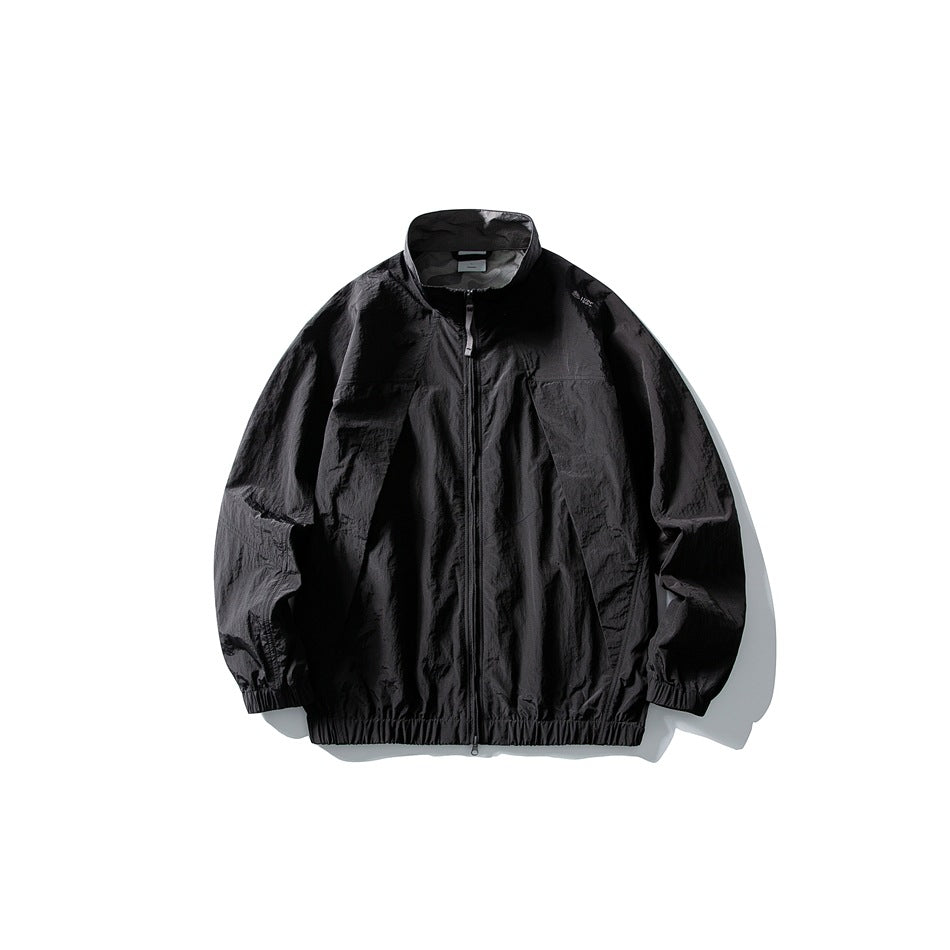 Black zip-up stand-collar jacket with crinkled texture and elastic cuffs and hem