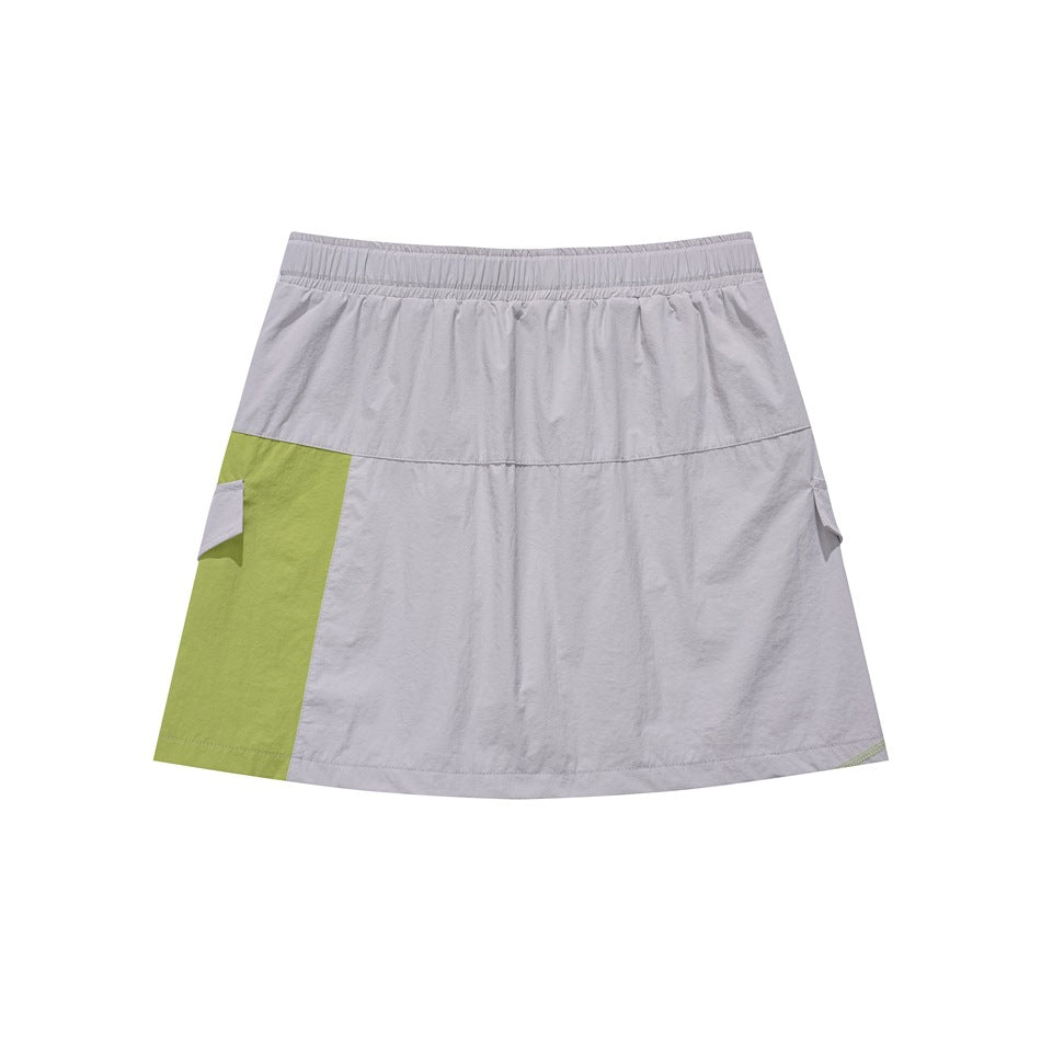 Front view of a light gray A-line skirt with a lime-green side panel, elastic waistband, and cargo-style pocket flaps.