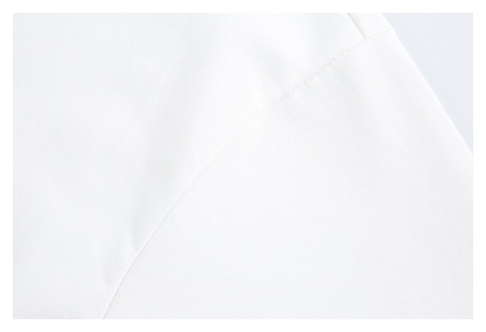 Close-up of a white T-shirt seam and fabric.