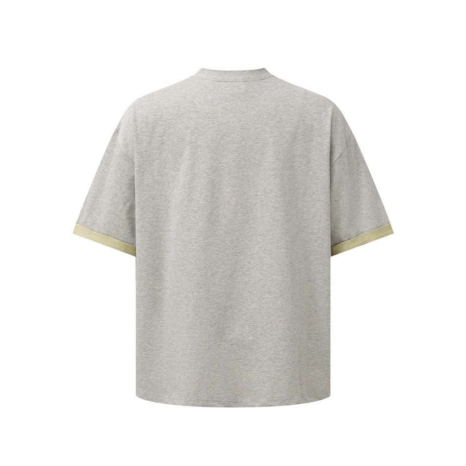 Back view of a heather gray T-shirt with pale yellow sleeve cuffs.