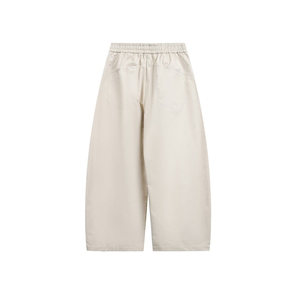 Beige wide-leg pants back view with elastic waistband and two patch back pockets