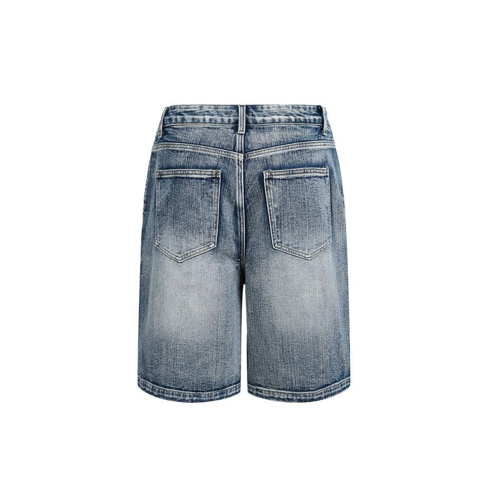 Back view of faded blue denim shorts with two patch pockets and contrast stitching, isolated on white.