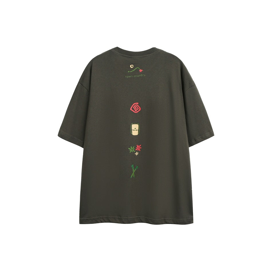 Back view of a dark olive oversized T-shirt with a vertical row of small colorful graphics.