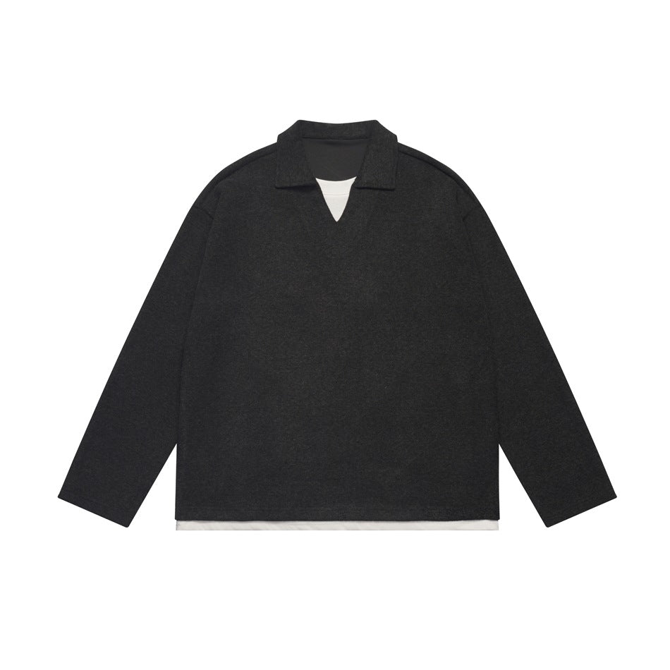 Black long-sleeve pullover with polo collar, V-neck and white layered under-hem, flat lay front view