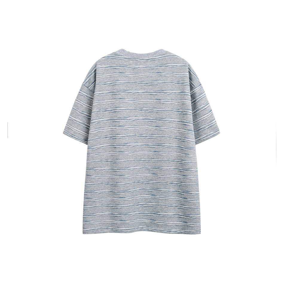 Back view of a gray short-sleeve T-shirt with irregular white and blue horizontal stripes.