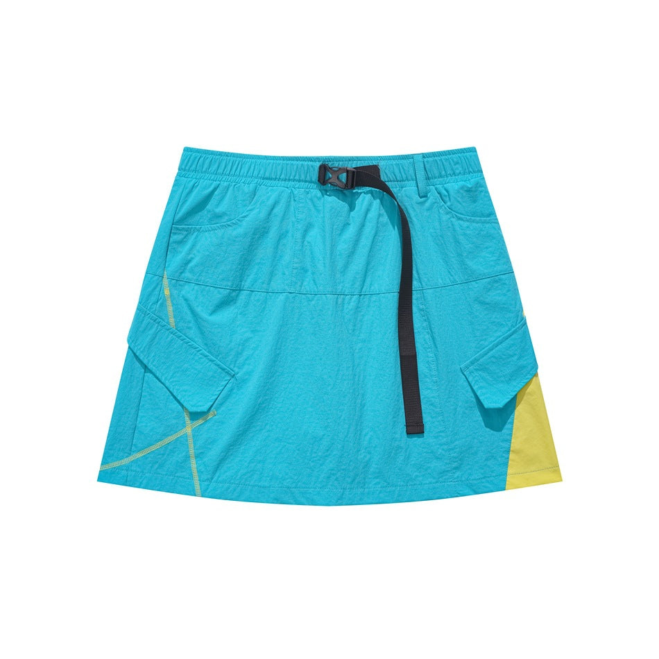 Bright blue mini cargo skirt with black buckle strap, flap pockets and yellow side panel