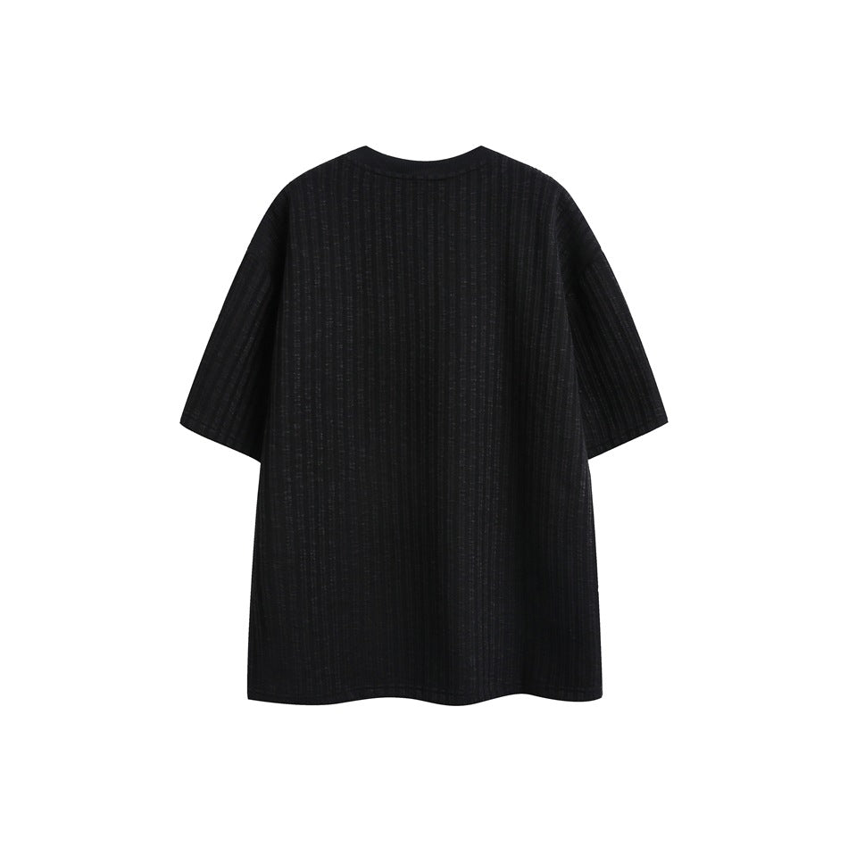 Back view of a black short-sleeve shirt with subtle vertical ribbing and a plain crew neckline.