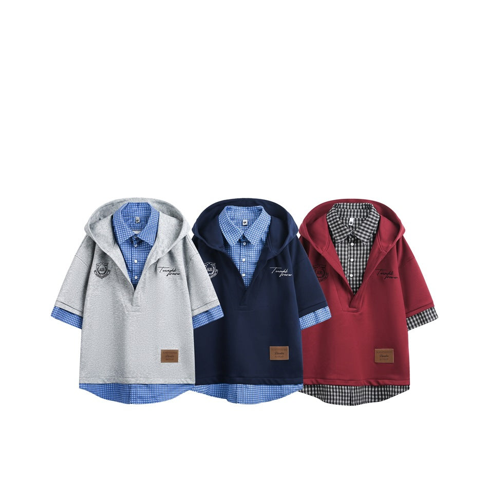 Three hooded short-sleeve pullovers displayed together in gray, navy, and burgundy with checked shirt layers.