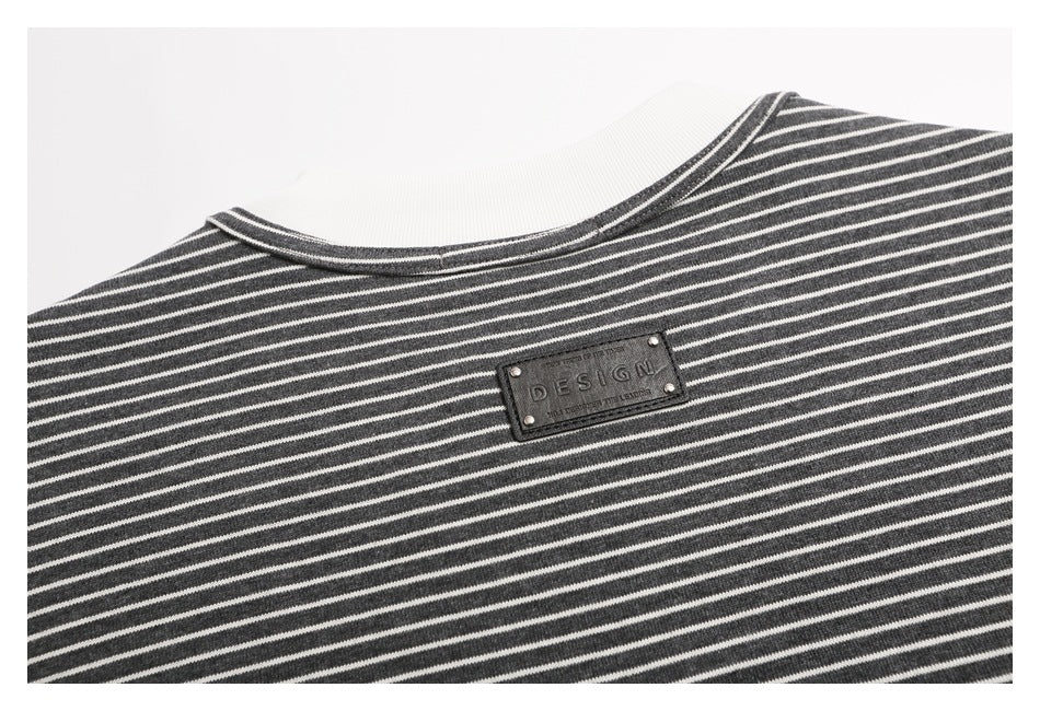 Close-up of the striped shirt's back neckline and small rectangular decorative patch.