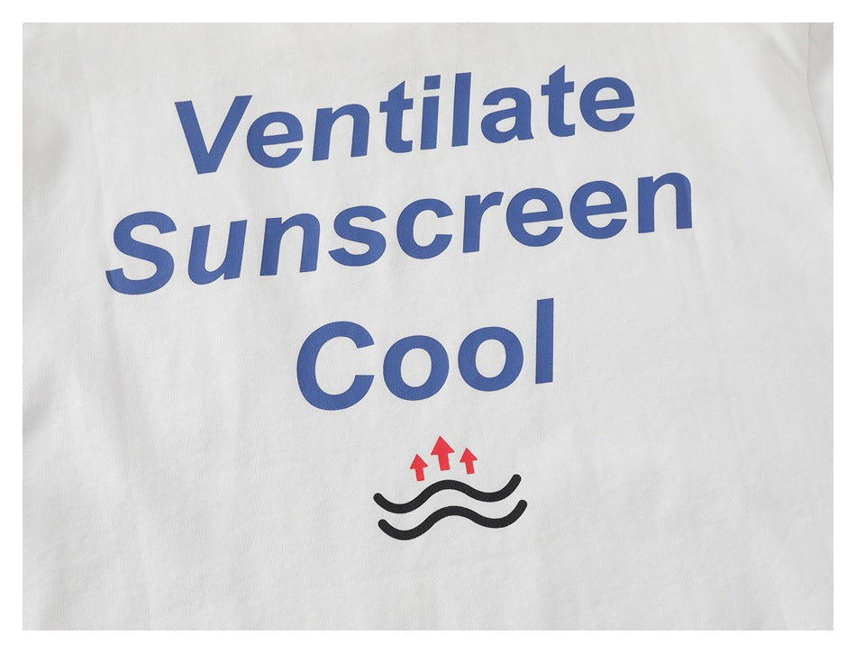 Close-up of a white garment with blue “Ventilate Sunscreen Cool” print and a heat-release graphic.