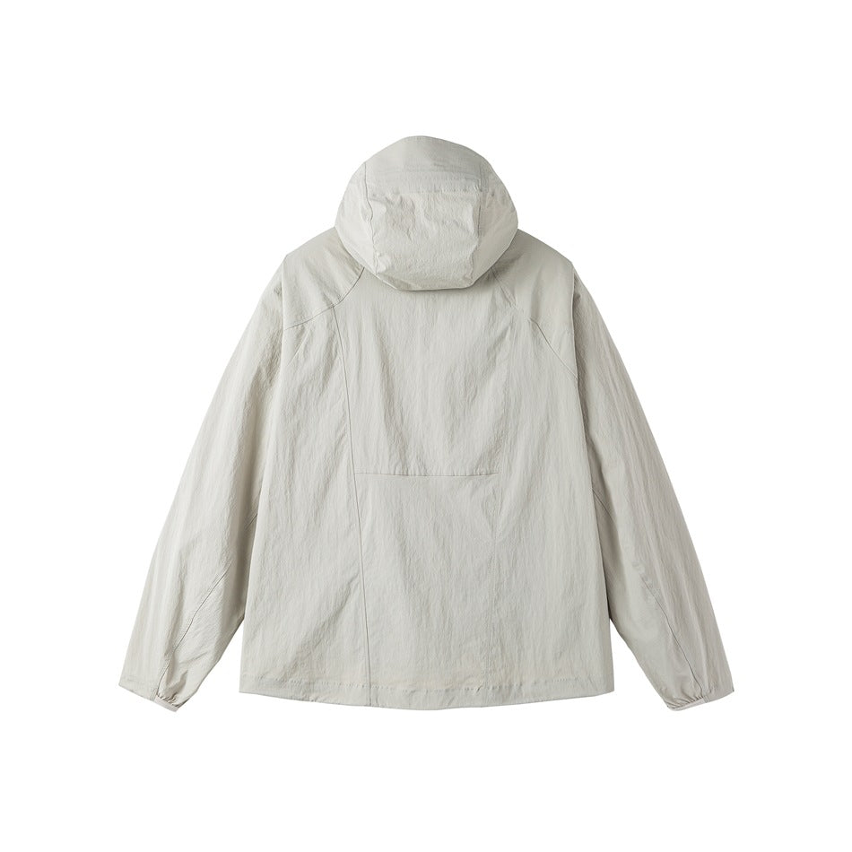 Back view of a pale sage hooded jacket with long sleeves and curved seam detailing.