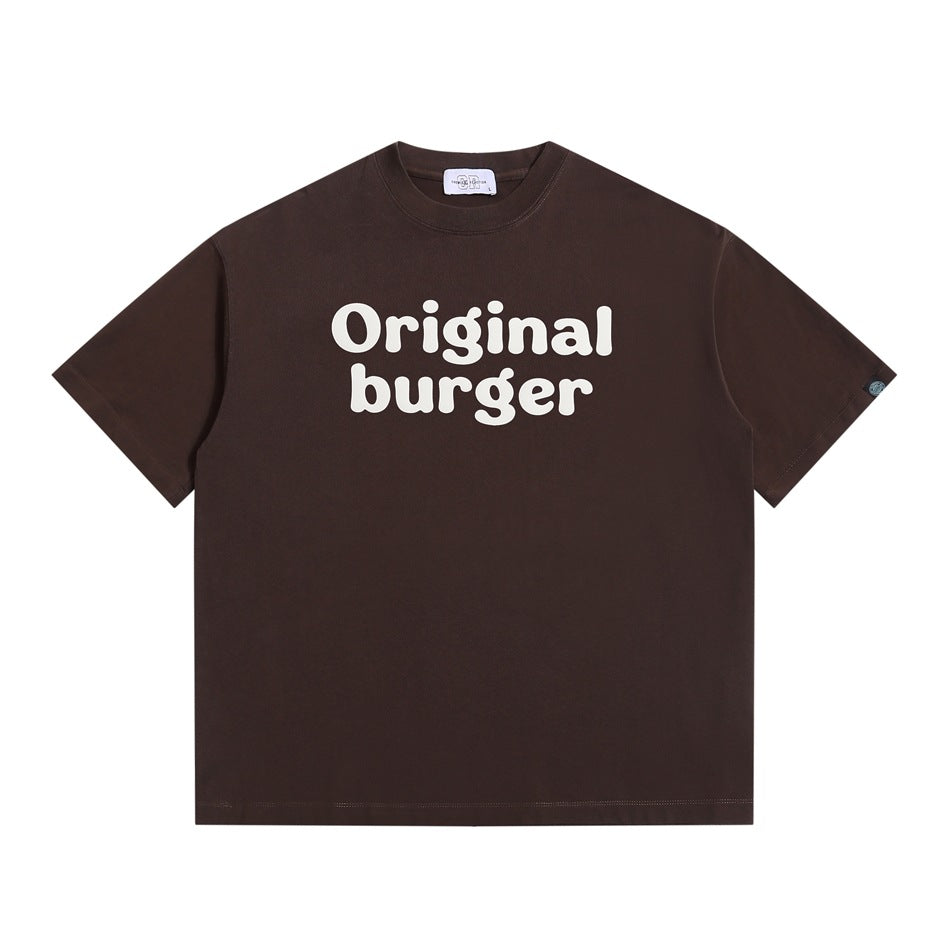Coffee brown short-sleeve T-shirt with cream "Original burger" bubble lettering on the chest, flat lay