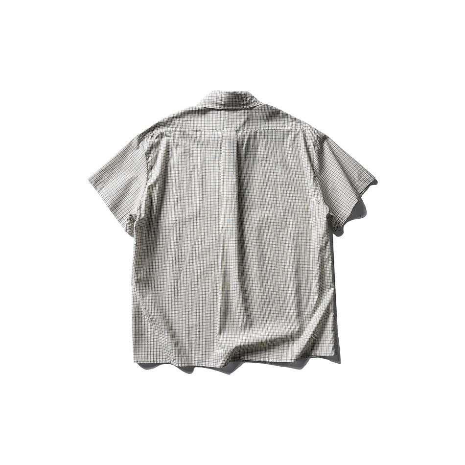 Flat-lay back of a short-sleeve check shirt in light cream grid pattern with a back yoke seam