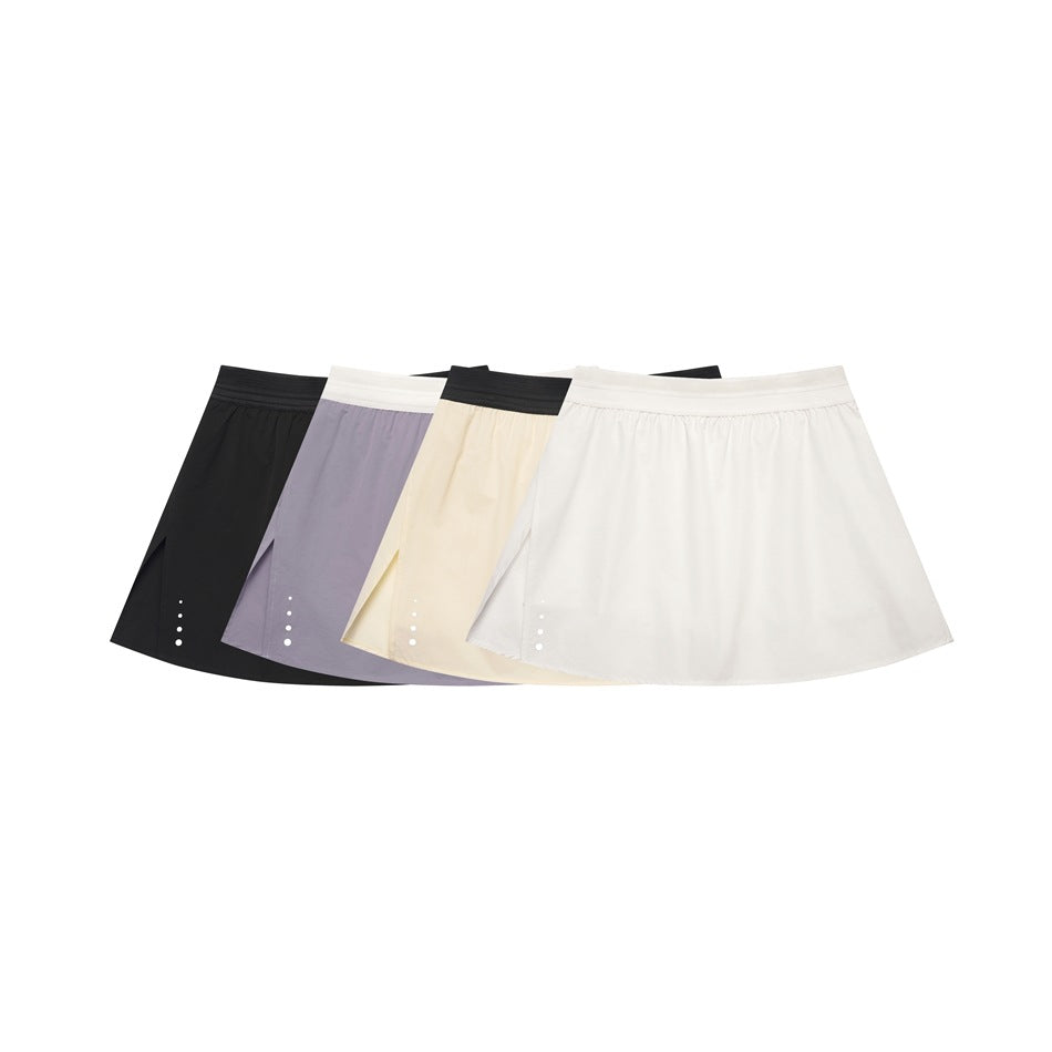 Four flared skirts displayed together in black, lavender, pale yellow, and white.